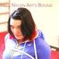 Jill tied and gagged on bed wearing a shiny black pants and a shiny blue rain jacket (Pics)