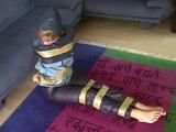 A video with one of our archive girls tied and gagged in shiny nylon rainwear