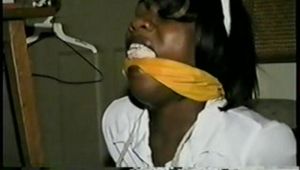 26 YR OLD BLACK BANK TELLER IS MOUTH STUFFED, HANDGAGGED, CLEAVE GAGGED, BALL-GAGGED, BAREFOOT & BALL-TIED ON THE FLOOR (D55-7)