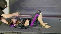 Lana handcuffed and gagged wearing a shiny nylon Windbreaker