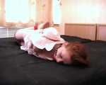 Barefoot nurse Gatitta tied up with a red rope (video)
