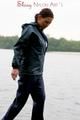 Sexy archive girl wearing a blue rain pant and rain jacket walking on a lake in freetime (Pics)