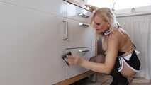 Busty blonde maid Cara cleans the kitchen