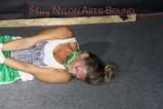 Watching sexy Sandra wearing a sexy green shorts and a white top being tied and gagged on the floor with ropes and a cloth gag (Pics)