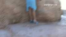 016180 Eve Stands By A Rock To Pee