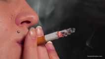 Smoking 100mm Marlboro Red in this closeup video 