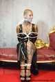 Miss Francine bound and gagged with layers of gags in a sexy PVC dress