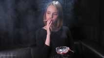 Dasha is smoking in the studio