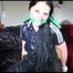 Lucy tied and gagged on a chair wearing a black jumpsuit (Video) 