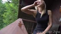 Vanessa is drinking in a hut