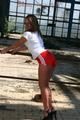 Stella posing outdoor wearing a supersexy red shiny nylon shorts and a white top (Pics)