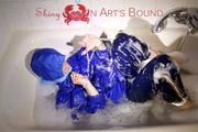 Sonja ties, gagges and hoodes herself in a bath tub wearing supersexy shiny nylon rainwear (Pics)