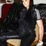 Lucy tied and gagged with rope and gag on a chair wearing a sexy black shiny nylon jumpsuit (Pics) 