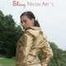 Watching out beautiful archive girl wearing a white shiny nylon shorts and a golden rain jacket posing outdoor (Pics)