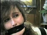 ERICA IS MOUTH STUFFED, WRAP TAPE GAGGED & BALL-TIED (D29-8)