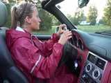 Watch Sandra taking a Walk during very hot Weather enjoying her rubberized oldschool Rainsuit