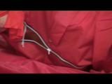 Video with Pia tied and gagged in shiny nylon rainwear
