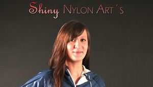 Alina posing in a studio wearing a supersexy blue rainwear combination (Pics)