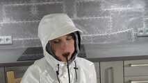 Miss Petra in nylon rain suit and heavy farmerrain rain gear and selfgagging