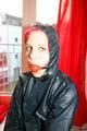 Marlin tied and gagged in a shiny blue rainsuit