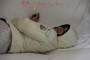 SEXY Jill wearing a WHITE rain pants and a WHITE down jacket lolling on the sofa playing with you (Pics)