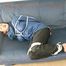 Katharina tied, gagged and hooded (breath control) on a sofa wearing sexy shiny nylon rainwear (Pics)