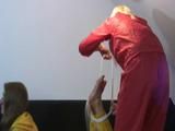 two short videos with our archive girls tid and gagged in shiny nylon rainwear