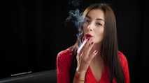 Gorgeous maneater Marina is smoking a 120mm with a short cigarette holder