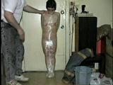 TINY TINA NAKED & MUMMY WRAPPED WITH PLASTIC WRAP & BLACK TAPE (D28-12)