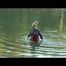 Jenny bathing in a lake and sun bathing wearing sexy red shiny nylon shorts and a rain jacket (Video)
