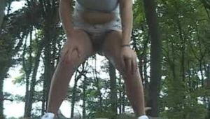 004028 Amber Takes A Very Long Pee On The Woodpile