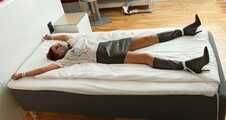 Spread eagle on bed