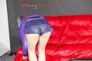Mara wearing a sexy purple shiny nylon shorts (selfmade) and a rain jacket during preparing her sofa (Pics)