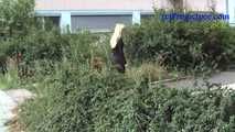 069017 Tiffany Pees Behind A Parked Trailer