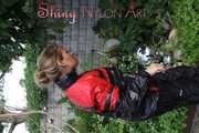 Watching sexy Sandra wearing a oldschool black/red shiny nylon rainwear combination while gardening outside (Pics)