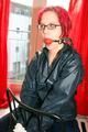 Marlin tied and gagged in a shiny blue rainsuit