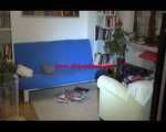 Mara sorting newspapers and lolling on the floor and the sofa wearing sexy shiny nylon downwear (Video)