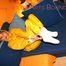 Archive girl tied and gagged on sofa wearing a shiny yellow rainwear (Pics)