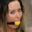 Yellow ballgag and ropes