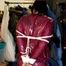 Jill tied and gagged in a semi-transparent purple PVC suit