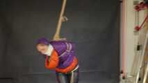 Rachel Adams bound, gagged and double hooded in shiny downjackets