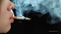 A young lady showing her smoking skills in a closeup video 