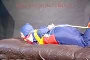 ***HOT HOT HOT*** SANDRA tied with ropes on the floor, gagged with a cloth gag wearing a sexy blue oldschool shiny nylon down suit (Pics)