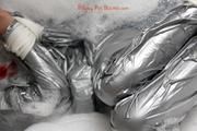 Simone in an shiny grey pvc sauna suit tied and gagged by Sophie in the bath tub (pics)