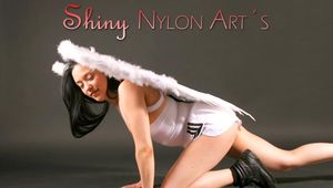 Blackhaired archive girl angle wearing sexy white shiny nylon shorts and a white top (Pics)