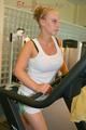 Katharina and Jenny during their workout in the fitness center wearing sexy shiny nylon shorts and tops (Pics)