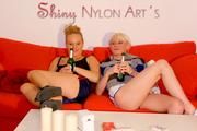 Jenny and Yvonne having a good time together wearing shiny nylon shorts and tops (Pics)