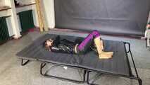 Lana handcuffed and gagged wearing a shiny nylon Windbreaker