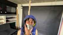 Lana bound and gagged in a shiny nylon Downvest