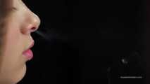 A young lady showing her smoking skills in a closeup video 